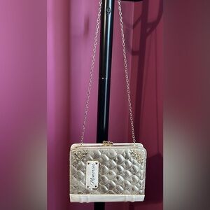 Claire’s gold quilted purse with a "Memories" label